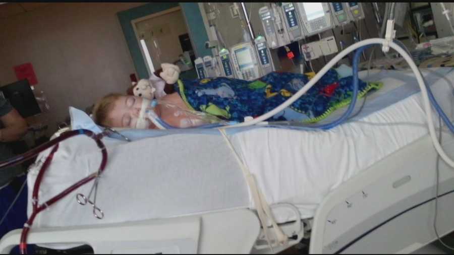 A Clinton toddler is fighting for his life after accidentally swallowing tiki torch fluid.