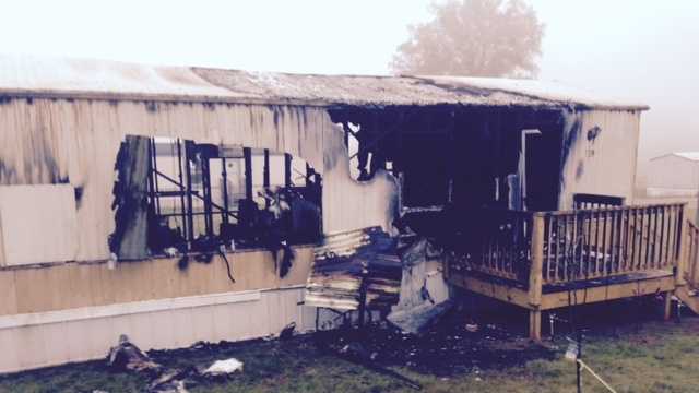 Fire burn a mobile home and sent an elderly woman to the hospital early Tuesday.