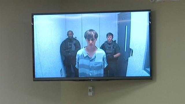Dylann Roof appears in court to hear his official charges. Bond was set for $1 million dollars on the weapons charge.