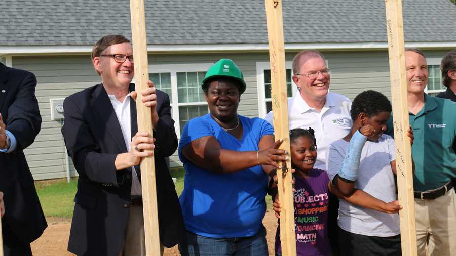 Homeowner Stacey Greene attends the wall-raising ceremony for her Habitat for Humanity house.