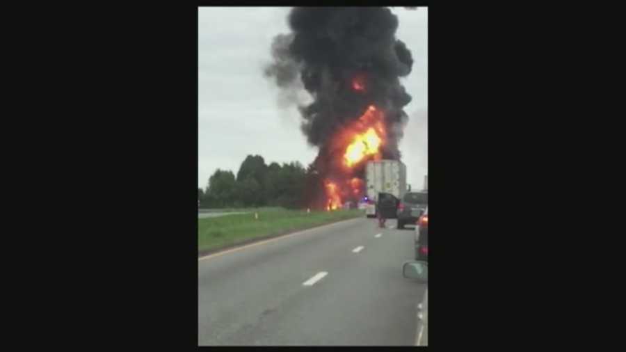 A fiery crash kills three people and prevented traffic from moving along Interstate 26 in Spartanburg County .