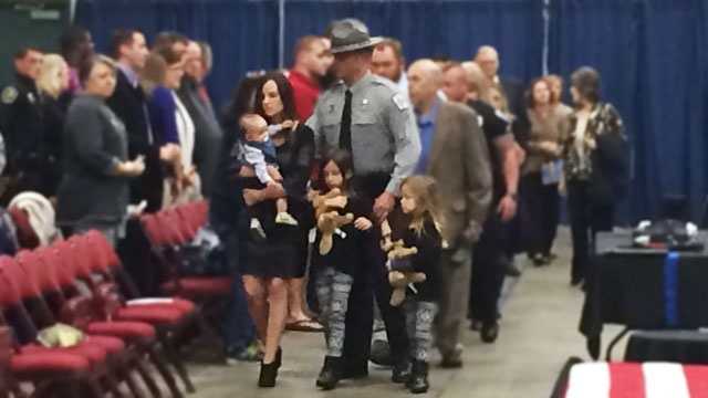 Deputy Brandon Surratt and his family at the memorial for Hyco.