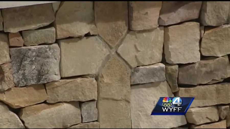A foundation has filed a complaint about a memorial cross embedded in stonework in Seneca.