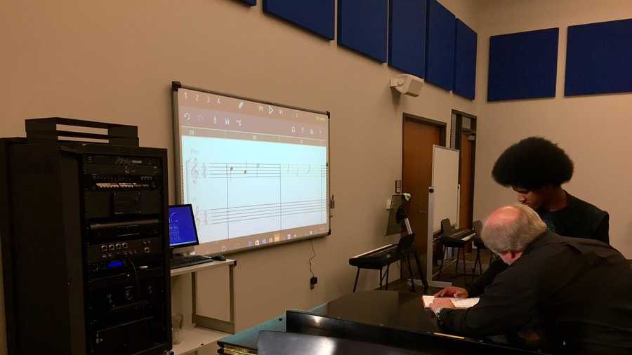 Dr. Lanny Lanford uses technology to help a student bring composed music to life at Spartanburg Methodist College.