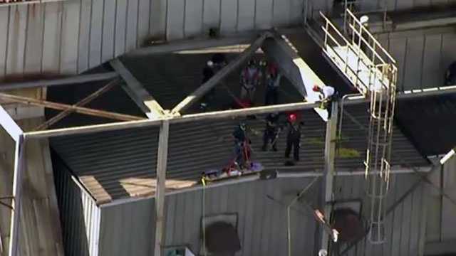 Pictures: Worker rescued after falling from scaffolding