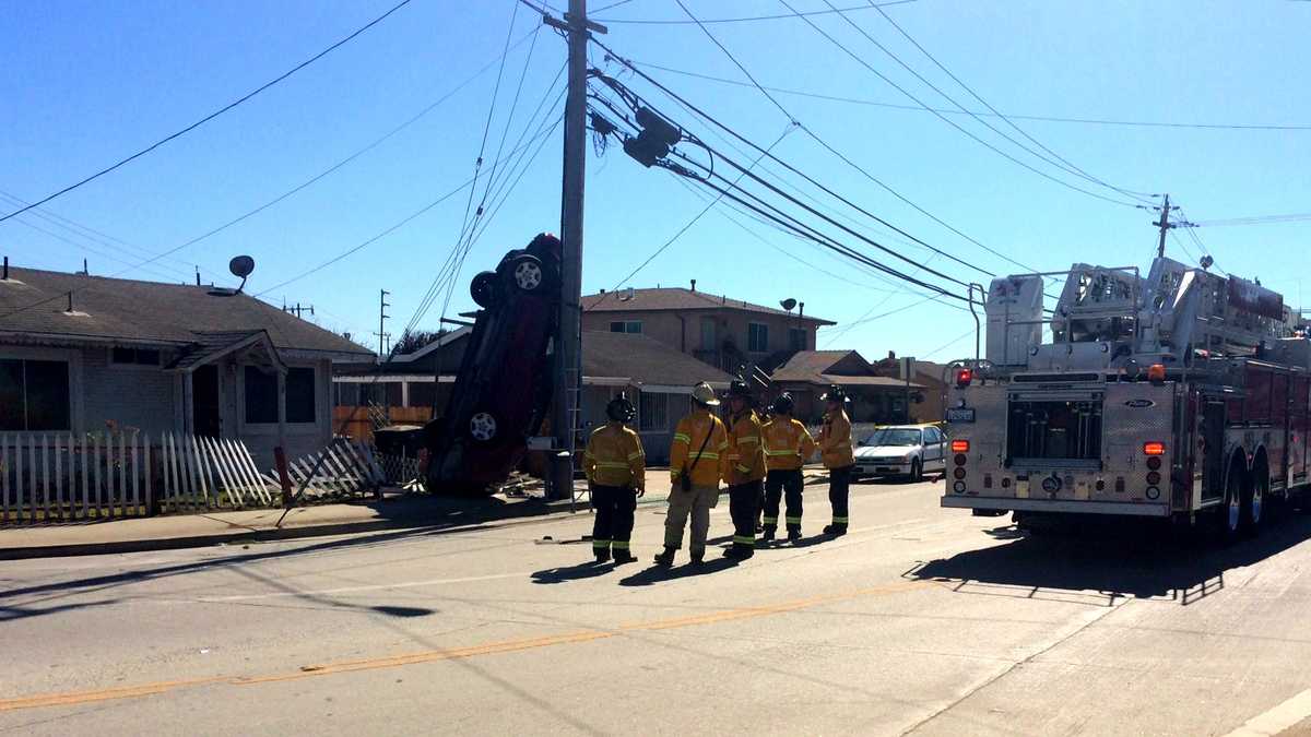 Major wreck in Salinas neighborhood ends with car on pole