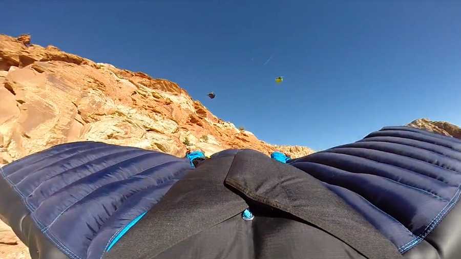 In this 2015 image, Mathew Kenney is seen among three wingsuit jumpers in Paria Canyon.