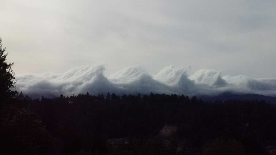 Puffy clouds, strong wind gusts, and a mountain ridge above the San Lorenzo Valley combined to form clouds that look like big waves in March 2016.