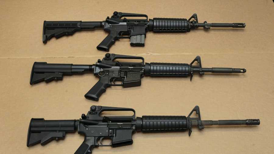 In this Aug. 15, 2012 file photo, three variations of the AR-15 assault rifle are displayed at the California Department of Justice in Sacramento, Calif. While the guns look similar, the bottom version is illegal in California because of its quick reload capabilities. Omar Mateen used an AR-15 that he purchased legally when he killed 49 people in an Orlando nightclub.