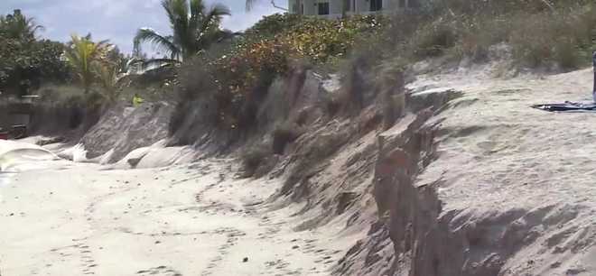 Florida beach erosion prompts safety measures and emergency sand haul