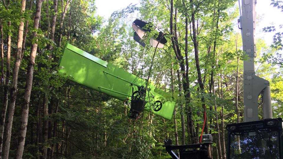Man crashes ultralight aircraft into wooded area