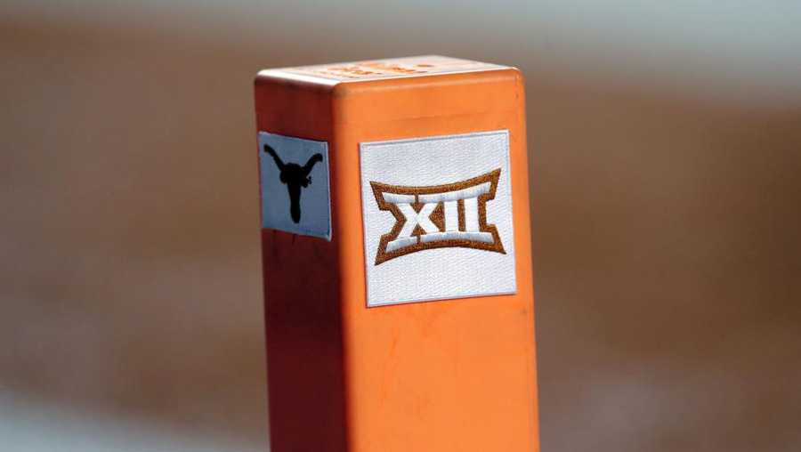 file - in this sept. 15, 2018, file photo, the big 12 conference logo is seen on a pylon during the first half of an ncaa college football game between texas and usc in austin, texas. texas and oklahoma made a request tuesday, july 27, 2021, to join the southeastern conference — in 2025 —- with sec commissioner greg sankey saying the league would consider it in the “near future.” (ap photo/eric gay, file)