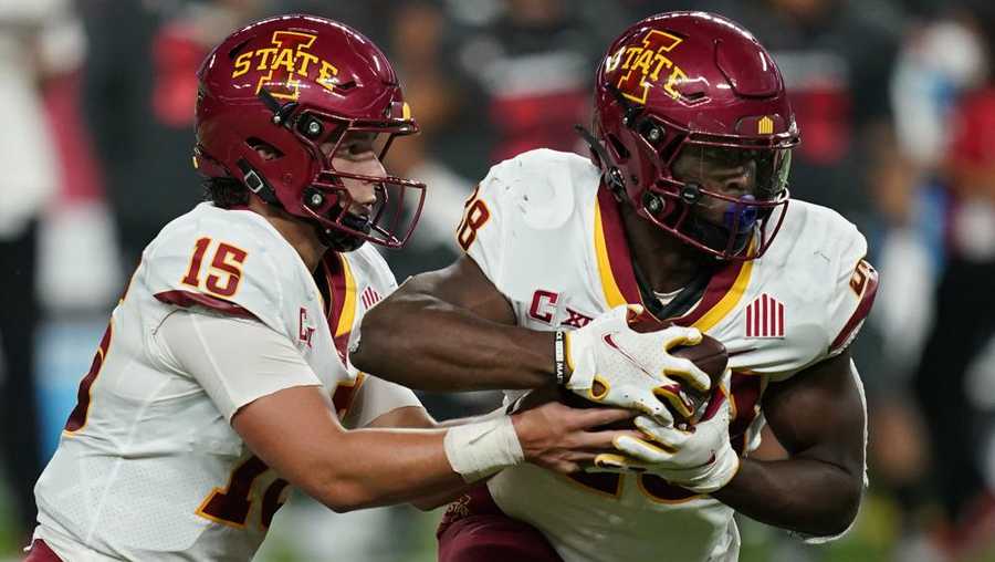 iowa state quarterback brock purdy (15) hands the ball off to running back breece hall (28) during the first half of an ncaa college football game against the unlv, saturday, sept. 18, 2021, in las vegas. (ap photo/john locher)
