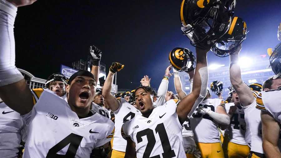 iowa players celebrate after defeating maryland 51-14 during an ncaa college football game, friday, oct. 1, 2021, in college park, md. (ap photo/julio cortez)
