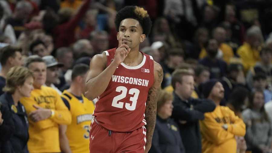 Wisconsin's Chucky Hepburn reacts after making a three-pointer during the second half of an NCAA college basketball game against Marquette Saturday, Dec. 3, 2022, in Milwaukee. Wisconsin won 80-77 in overtime.