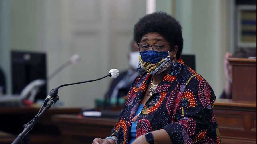 FILE - In this June 11, 2020, file photo, Assemblywoman Shirley Weber, D-San Diego, wears a face mask as she calls on lawmakers to create a task force to study and develop reparation proposals for African Americans, during the Assembly session in Sacramento, Calif. California lawmakers are setting up a task force to study and make recommendations for reparations to African-Americans, particularly the descendants of slaves, as the nation struggles again with civil rights and unrest following the latest shooting of a Black man by police. The state Senate supported creating the nine-member commission on a bipartisan 33-3 vote Saturday, Aug. 29, 2020