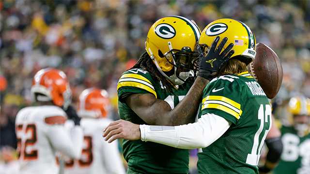 Green Bay Packers' Davante Adams celebrates his touchdown reception with Aaron Rodgers during the first half of an NFL football game against the Cleveland Browns Saturday, Dec. 25, 2021, in Green Bay, Wis.