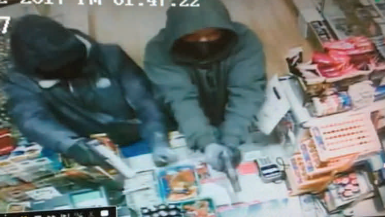 Two armed robbers were seen on surveillance video on Monday, Jan. 2, 2017, at a Grass Valley business, the Grass Valley Police Department said.