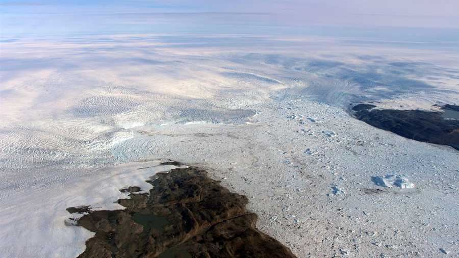 Patches of bare land are seen at the Jakobshavn glacier in Greenland in 2016, but the glacier ice has started to grow again, according to a study released on March 25, 2019. Study authors and outside scientists think this is temporary.