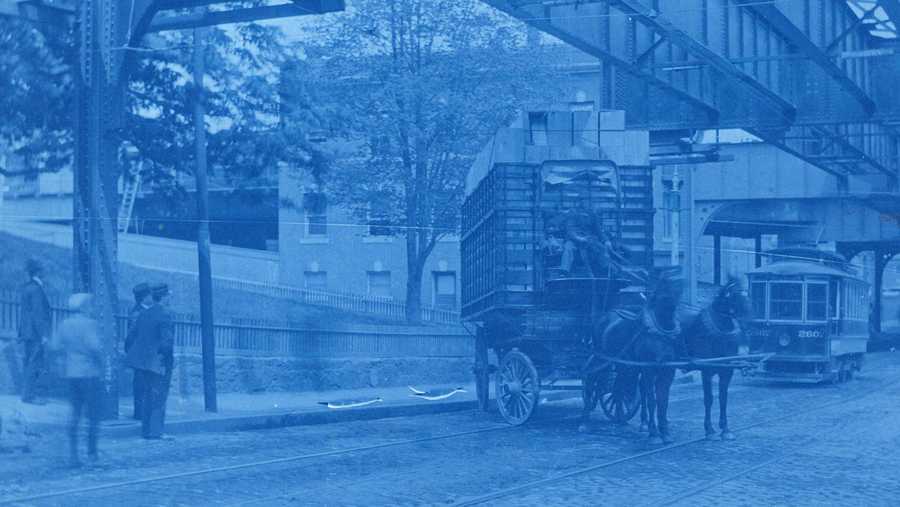 caption reads: "washington st. south of guild st. high-loaded wagon hitting trolley wire. 11:45 a.m. may 12, 1906"
