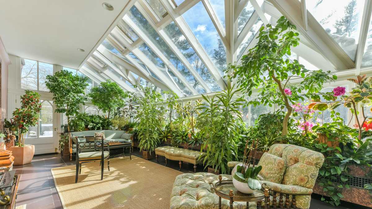 $4.85M stately brick colonial has conservatory, superb gym