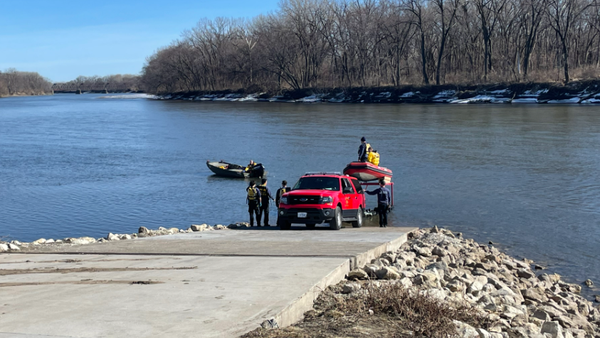 Search crews launch boats on the Des Moines River after receiving reports of a body in the water Friday afternoon.