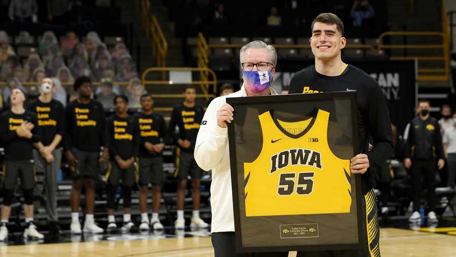 Iowa Hawkeyes center Luka Garza (55) stands with Iowa Hawkeyes head coach Fran McCaffery during senior day festivities before their game against the Wisconsin Badgers Sunday, March 7, 2021 at Carver-Hawkeye Arena. (Brian Ray/hawkeyesports.com)
