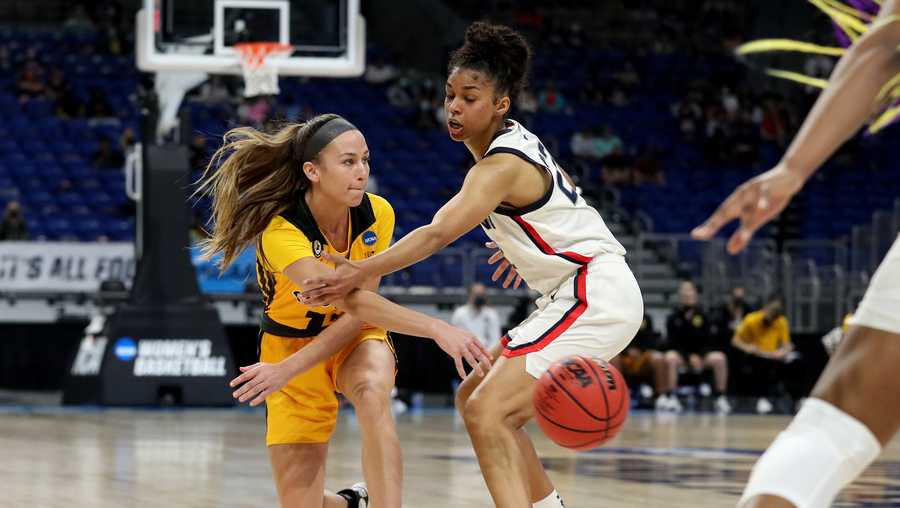 Iowa Hawkeyes guard Megan Meyer (11) passes the ball around UConn Huskies guard Evina Westbrook (22) in the Sweet 16 of the 2021 NCAA Women’s Basketball Tournament Saturday, March 27, 2021 at the Alamo Dome. (Stephen Mally/hawkeyesports.com)