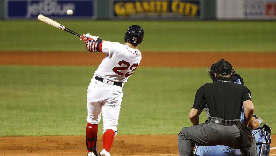 Boston Red Sox&apos;s Michael Chavis hits an RBI single against the Toronto Blue Jays during the third inning of the second game of a baseball doubleheader Friday, Sept. 4, 2020, at Fenway Park in Boston. (AP Photo/Winslow Townson)