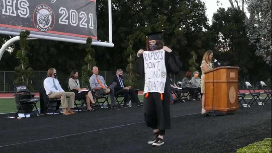 sofia rossi graduated from los gatos high school on june 4, 2021, carrying a sign reading "rapists don't belong @ graduation."
