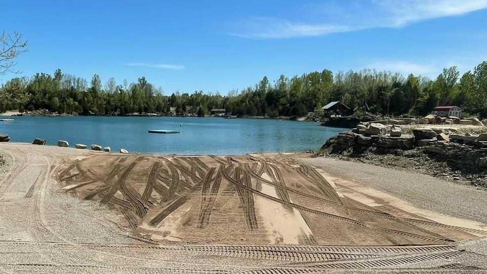 The kid-free floating quarry in Oldham County now has a beach
