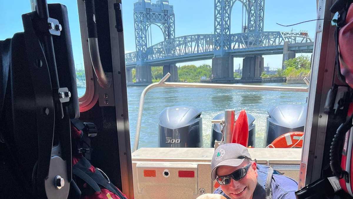 Civilian, firefighters rescue dog that was thrown off bridge and into river