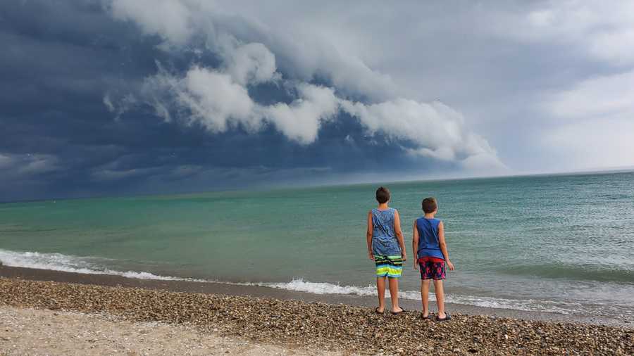 "Beach time when storm came rolling in on Lake Michigan by Grant Park Beach in South Milwaukee this afternoon."