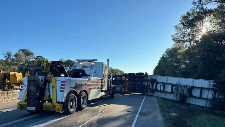 Overturned truck causing heavy delays on I-12 East