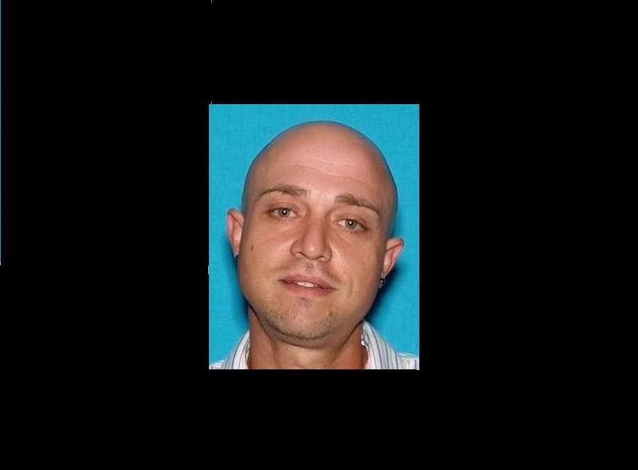 "Armed And Dangerous" Domestic Violence Suspect Surrenders To Police