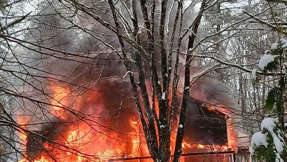 Officials: Family escapes house fire in Warren; home a total loss