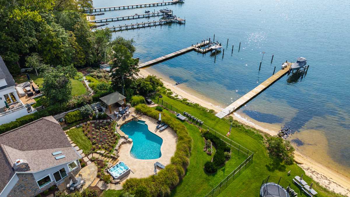Home with private beach, pier sets neighborhood price record