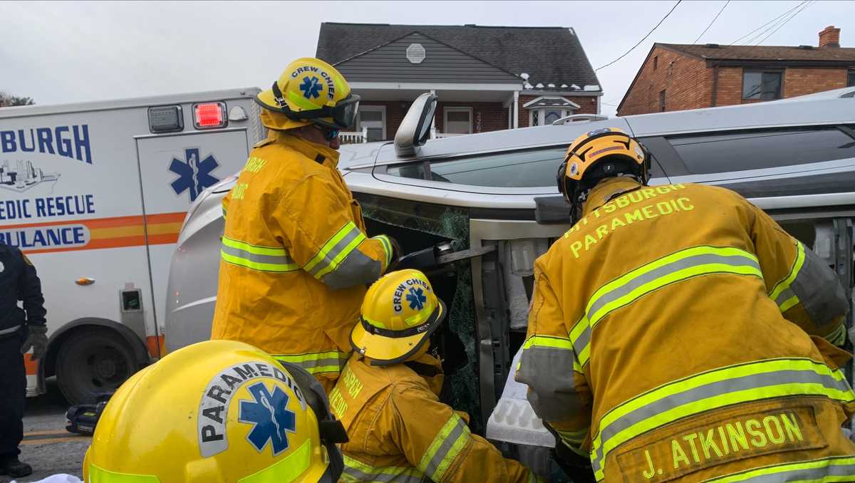 Rescue crews remove roof to free trapped driver after rollover in ...