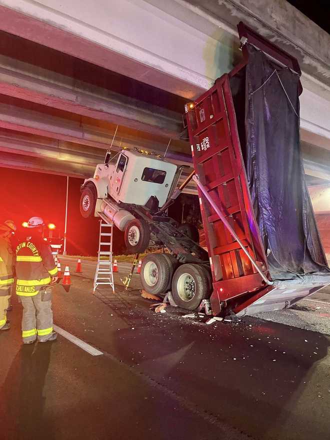 Dump truck strikes overpass bridge on I-95 in Martin County