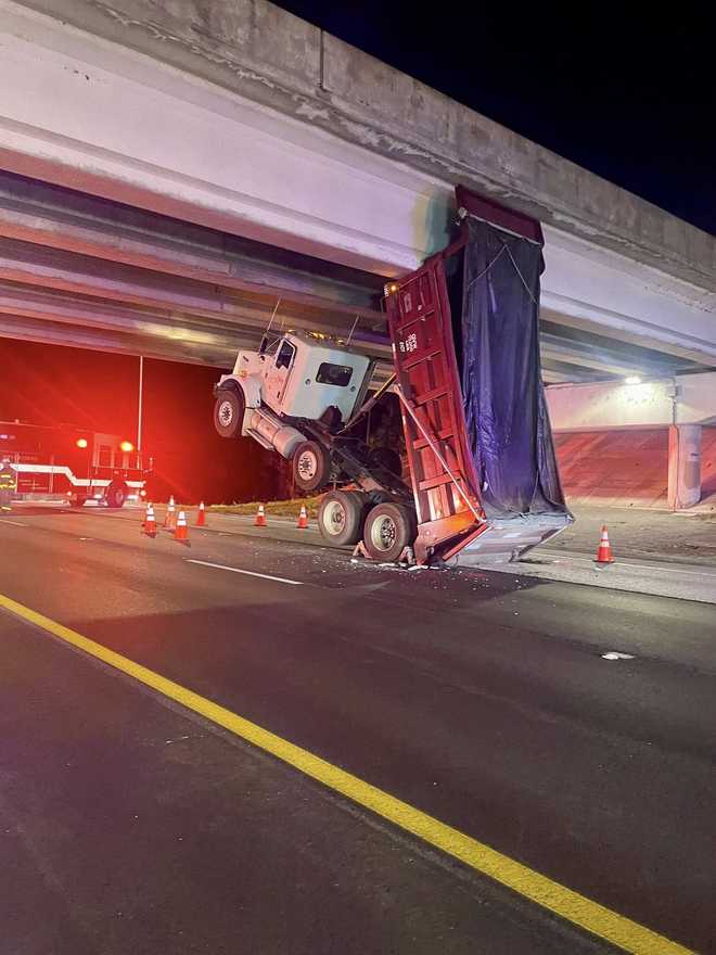 Dump truck strikes overpass bridge on I-95 in Martin County