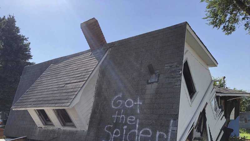 A photo of a demolished house with the words “Got the Spider!” painted on the roof has made the rounds on social media after a couple decided to have a little fun.