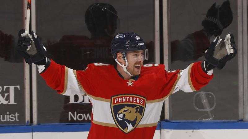 FILE - Florida Panthers center Sam Bennett (9) celebrates after scoring a goal against the Blue Jackets during the first period of an NHL hockey game in Sunrise, Fla., in this Tuesday, April 20, 2021, file photo. Sam Bennett re-signed with the Florida Panthers on Monday, July 26, 2021, inking a four-year contract with the team that has been a good fit for him since joining at the trade deadline. (AP Photo/Joel Auerbach, FIle)