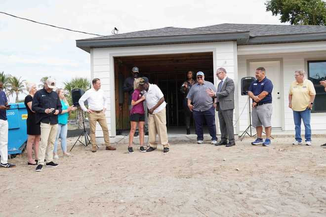Builders Care, project partners celebrate milestone of no-cost home build for Fort Myers resident