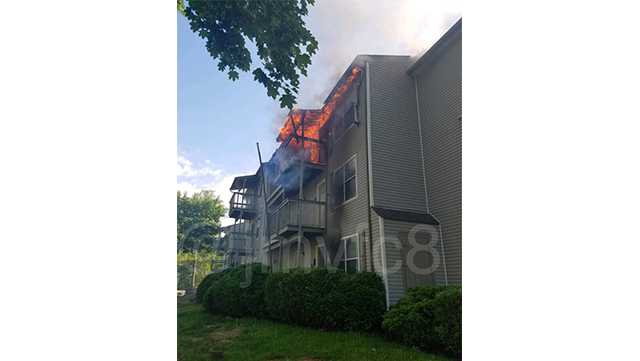 Firefighters are battling a two-alarm apartment fire Tuesday in Abingdon.