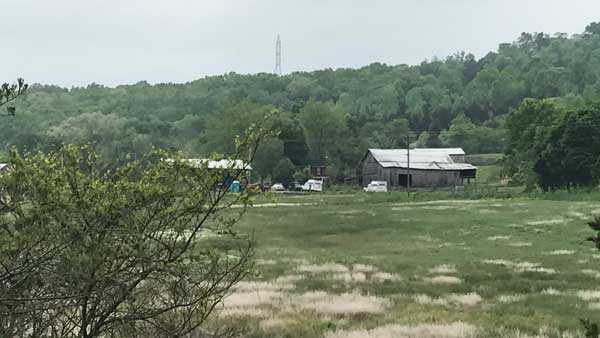 Police search 2 properties near site of Rhoden family massacre