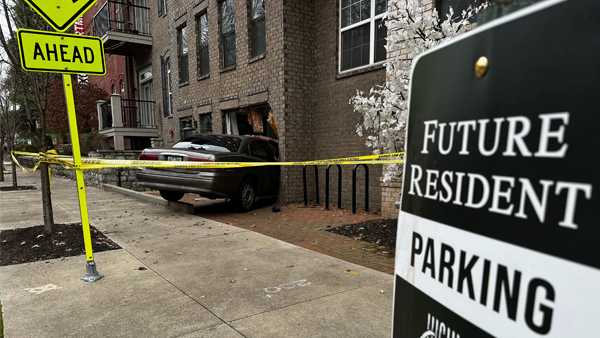 Woman cited after crashing into Highlands apartment complex