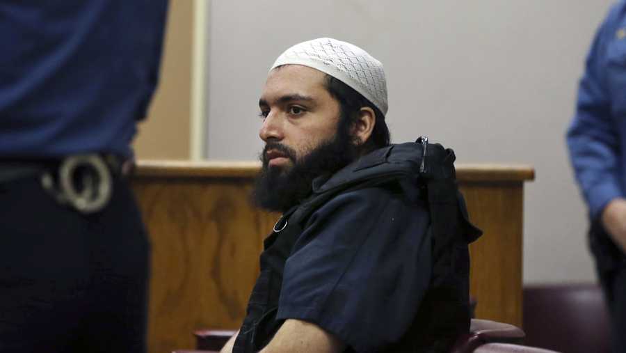 In this Dec. 20, 2016 file photo, Ahmad Khan Rahimi, the man accused of setting off bombs in New Jersey and New York's Chelsea neighborhood in September, sits in court in Elizabeth, N.J. Prosecutors are urging a judge to impose a life sentence on Rahimi. The government made its arguments in papers filed Tuesday, Jan. 16, 2018, in Manhattan federal court.