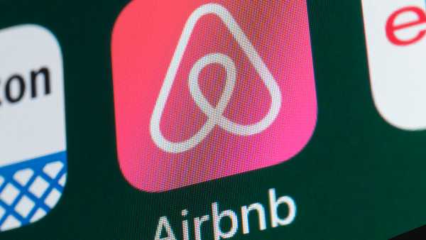 London, UK - July 31, 2018: The buttons of the travel app Airbnb, surrounded by Amazon, ebay, News and other apps on the screen of an iPhone.