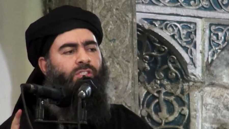 This file image made from video posted on a militant website Saturday, July 5, 2014, purports to show the leader of the Islamic State group, Abu Bakr al-Baghdadi, delivering a sermon at a mosque in Iraq during his first public appearance.