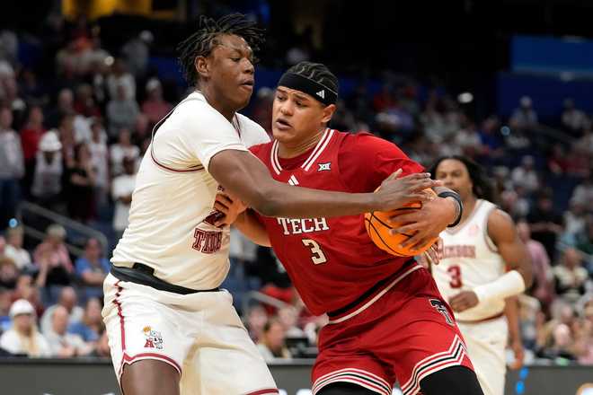 Alabama forward Aiden Sherrell (22) fouls Texas Tech forward Lejuan Watts (3) during the second half in the second round of the NCAA college basketball tournament Monday, March 23, 2026, in Tampa, Fla.